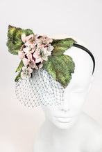 Load image into Gallery viewer, Fascinator headpiece with pink hydrangeas, large green leaves, and black birdcage netting