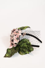 Load image into Gallery viewer, Fascinator headpiece with pink hydrangeas, large green leaves, and black birdcage netting
